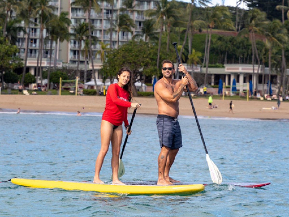 a person riding a surf board on a body of water