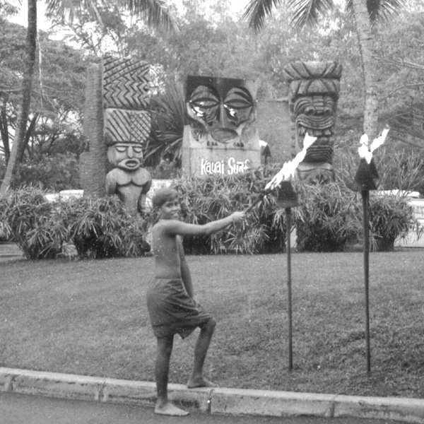 Kauai Surf in the 1960s - boy lighting a torch