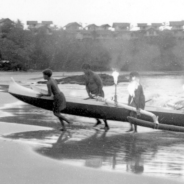 Outrigger Canoe being pulled out of Kalapaki Bay, Percy Kinimaka