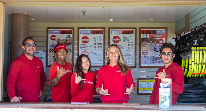 a group of people standing in front of a store