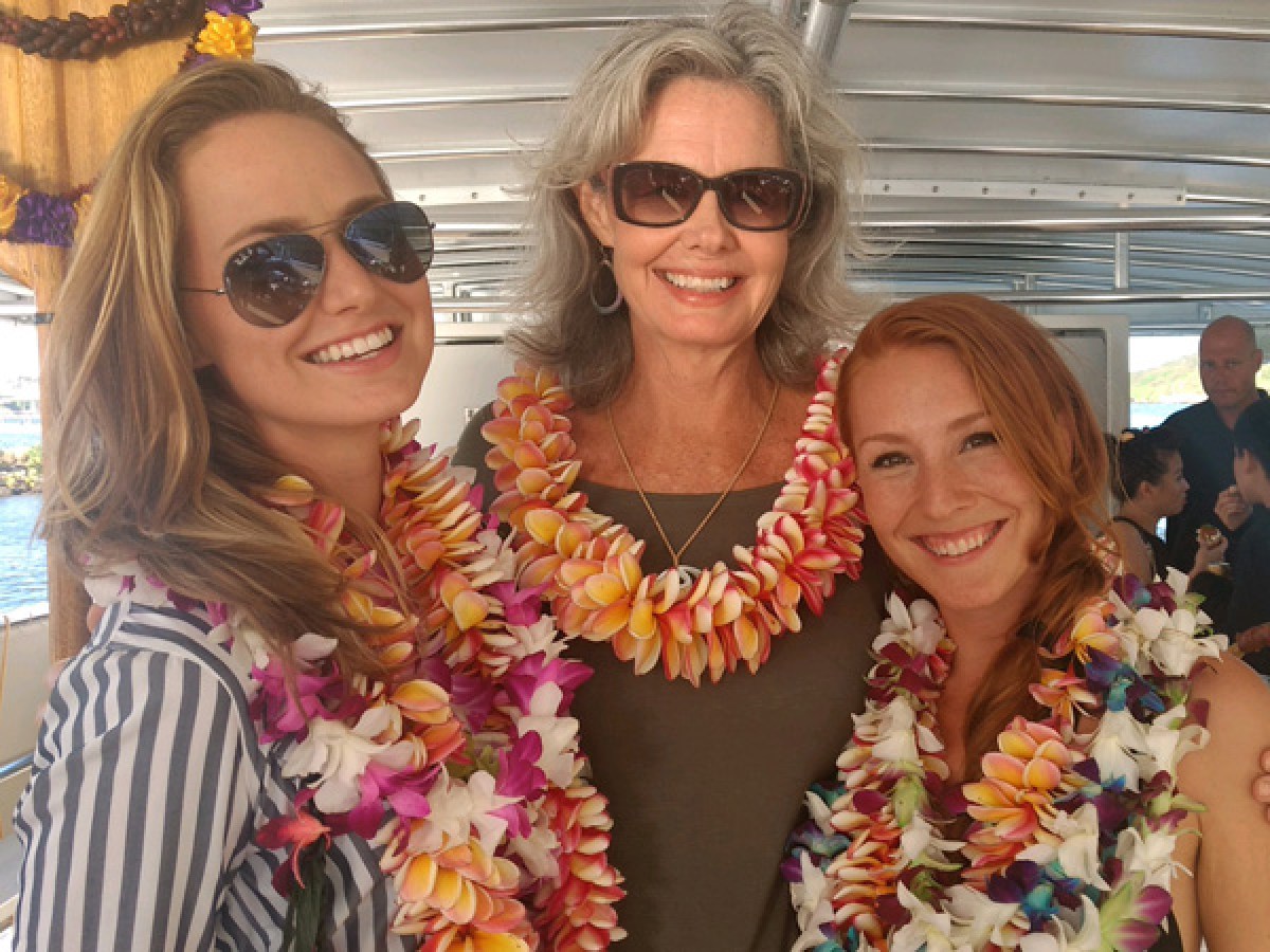a woman standing in front of a cake